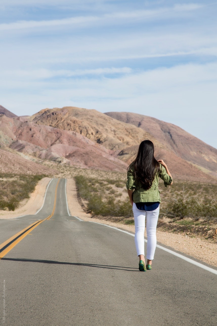 Casual road trip travel wear- white jeans, military jacket and sequined tank